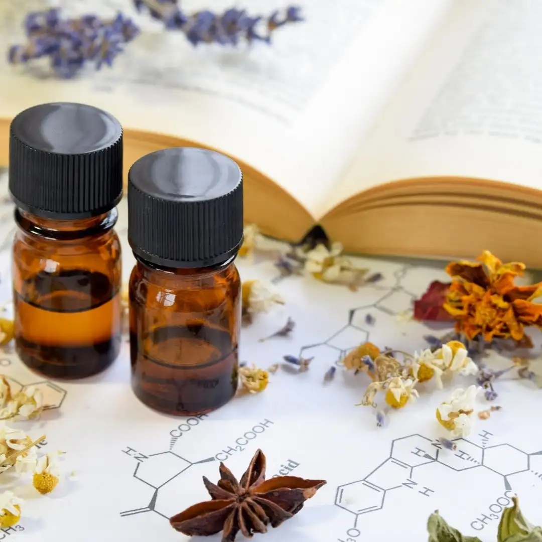 Essential oil bottles with star anise and lavender